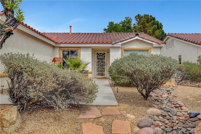 5220 Shasta Daisy St, North Las Vegas, NV 89031 - view of front of property with stucco siding and a tiled roof
