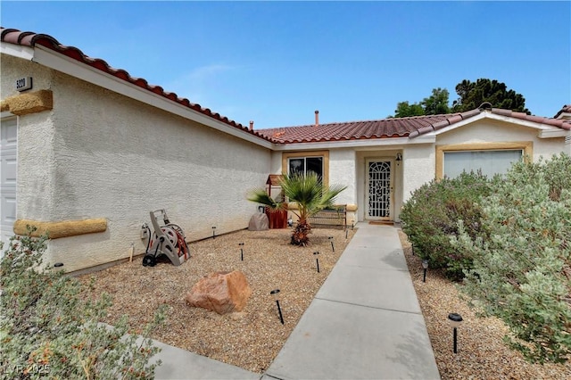 5220 Shasta Daisy St, North Las Vegas, NV 89031 - view of front of home featuring a tiled roof and stucco siding