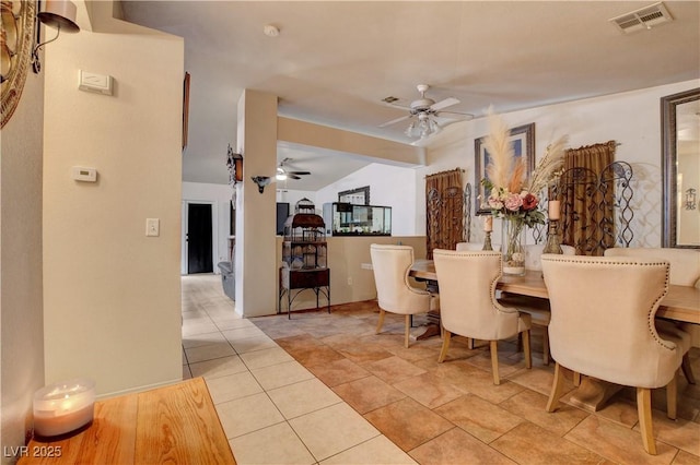 5220 Shasta Daisy St, North Las Vegas, NV 89031 - dining room with a ceiling fan, vaulted ceiling, and tile patterned floors