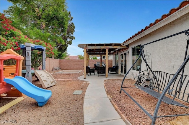 5220 Shasta Daisy St, North Las Vegas, NV 89031 - view of playground featuring a fenced backyard and a patio area