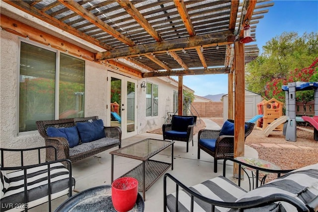 5220 Shasta Daisy St, North Las Vegas, NV 89031 - view of patio / terrace featuring an outdoor hangout area, a shed, a pergola, an outbuilding, and fence