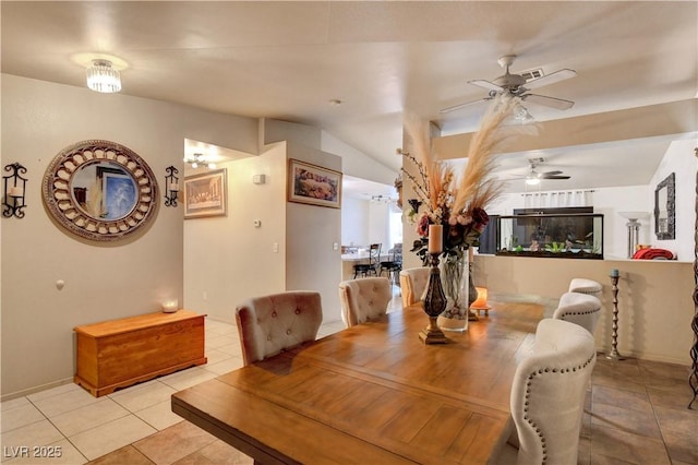 5220 Shasta Daisy St, North Las Vegas, NV 89031 - dining area with a ceiling fan, light tile patterned flooring, vaulted ceiling, and baseboards