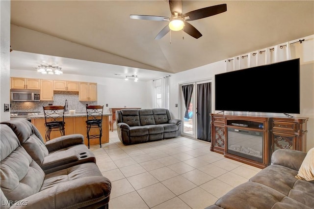 5220 Shasta Daisy St, North Las Vegas, NV 89031 - living area with light tile patterned flooring, lofted ceiling, and ceiling fan