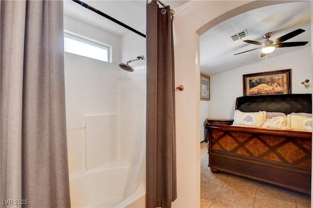 5220 Shasta Daisy St, North Las Vegas, NV 89031 - bathroom featuring a ceiling fan, vaulted ceiling, shower / tub combo with curtain, and tile patterned floors