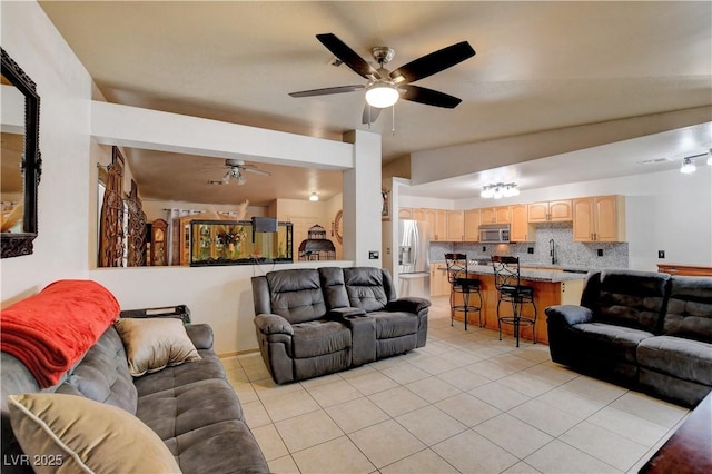 5220 Shasta Daisy St, North Las Vegas, NV 89031 - living room featuring a ceiling fan and light tile patterned floors
