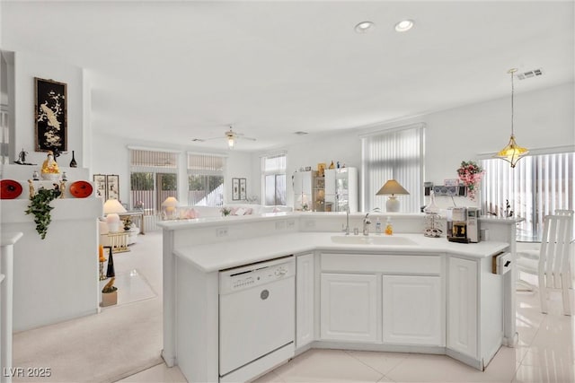 6141 Markleham Ave, Las Vegas, NV 89130 - kitchen with dishwasher, recessed lighting, ceiling fan, light countertops, and white cabinets