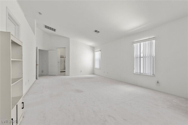 6141 Markleham Ave, Las Vegas, NV 89130 - spare room with light carpet and lofted ceiling