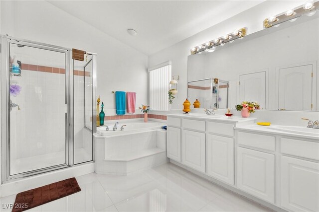 6141 Markleham Ave, Las Vegas, NV 89130 - full bathroom featuring a stall shower, a bath, double vanity, tile patterned floors, and lofted ceiling
