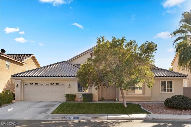 6141 Markleham Ave, Las Vegas, NV 89130 - mediterranean / spanish home with stucco siding, driveway, an attached garage, and a tile roof