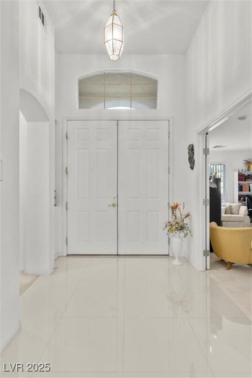 entrance foyer featuring tile patterned flooring