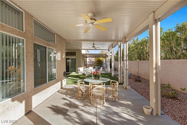 6141 Markleham Ave, Las Vegas, NV 89130 - fenced backyard featuring a ceiling fan, outdoor dining area, and a patio