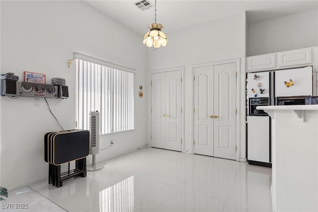 6141 Markleham Ave, Las Vegas, NV 89130 - entryway featuring a chandelier and light tile patterned floors