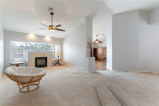 1933 Davina St, Henderson, NV 89074 - living room with ceiling fan, lofted ceiling, light colored carpet, a fireplace, and baseboards