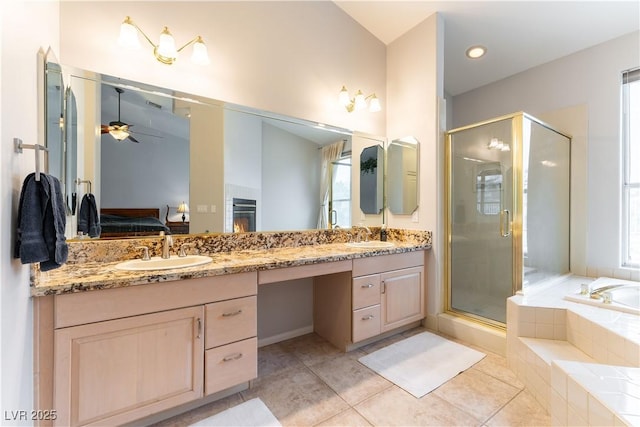 1933 Davina St, Henderson, NV 89074 - ensuite bathroom with ceiling fan, a stall shower, double vanity, a garden tub, and vaulted ceiling