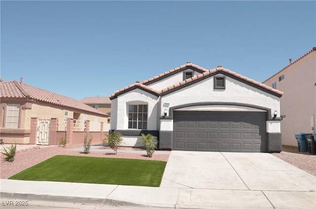 mediterranean / spanish home featuring a tile roof, an attached garage, concrete driveway, stucco siding, and a front lawn