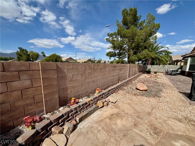 5422 Nestled Moon Ct, Las Vegas, NV 89131 - fenced backyard with a patio