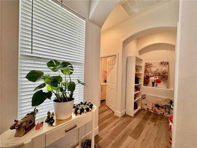 5422 Nestled Moon Ct, Las Vegas, NV 89131 - hall featuring light wood finished floors and arched walkways