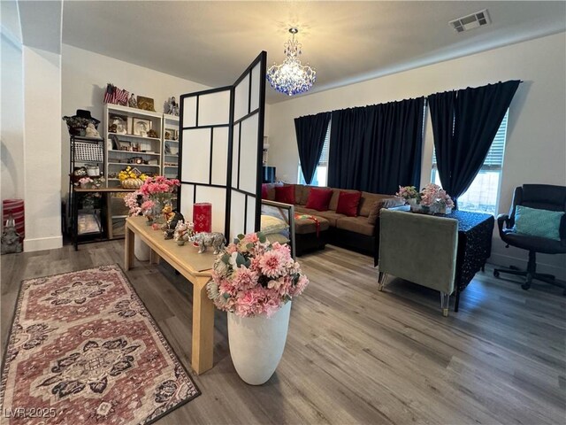 5422 Nestled Moon Ct, Las Vegas, NV 89131 - living room featuring wood finished floors and a chandelier