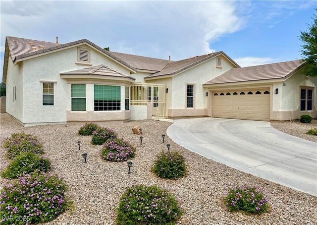 5422 Nestled Moon Ct, Las Vegas, NV 89131 - ranch-style house featuring an attached garage, stucco siding, concrete driveway, and a tile roof