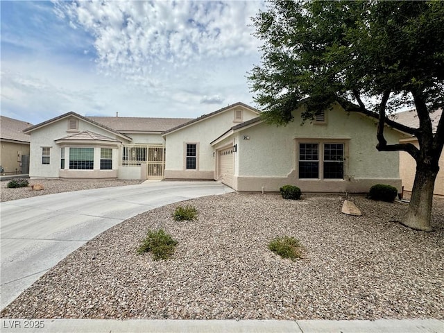5422 Nestled Moon Ct, Las Vegas, NV 89131 - view of front facade with driveway, stucco siding, and a garage