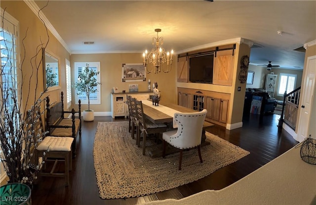 dining room with dark wood finished floors, a chandelier, baseboards, and ornamental molding