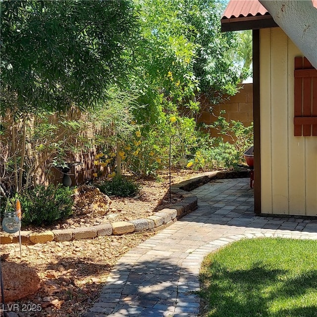view of yard with fence and a patio area