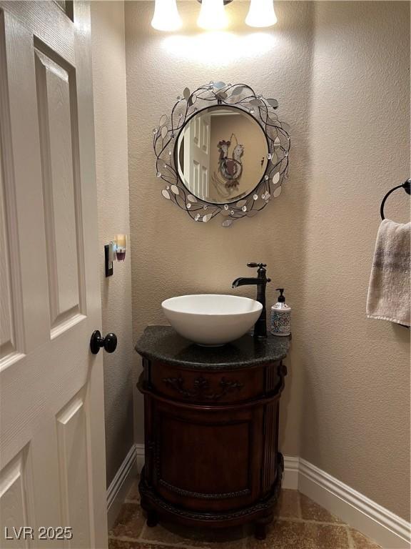 bathroom featuring vanity and baseboards