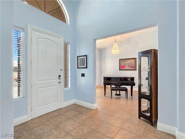 3780 Shawnee Ave, Pahrump, NV 89048 - foyer featuring baseboards, light tile patterned floors, and plenty of natural light
