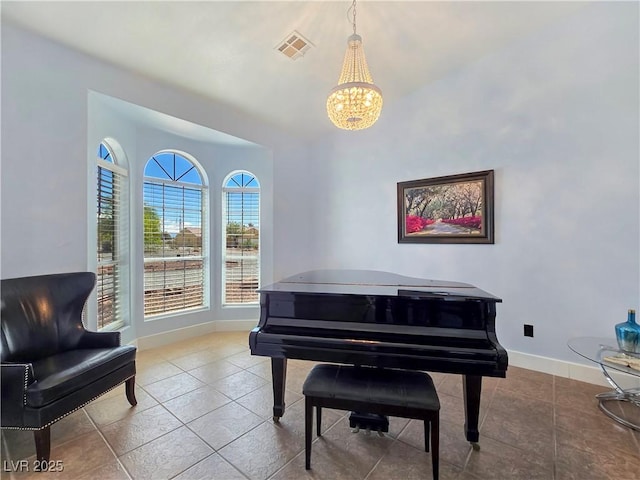 3780 Shawnee Ave, Pahrump, NV 89048 - living area with a chandelier, baseboards, and tile patterned flooring