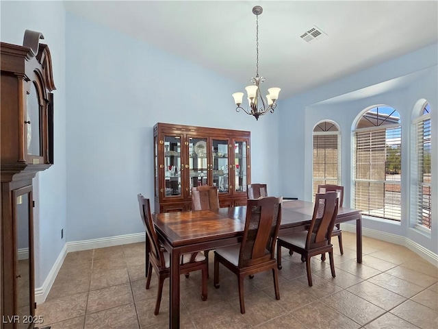 3780 Shawnee Ave, Pahrump, NV 89048 - dining area featuring a chandelier, baseboards, and light tile patterned floors
