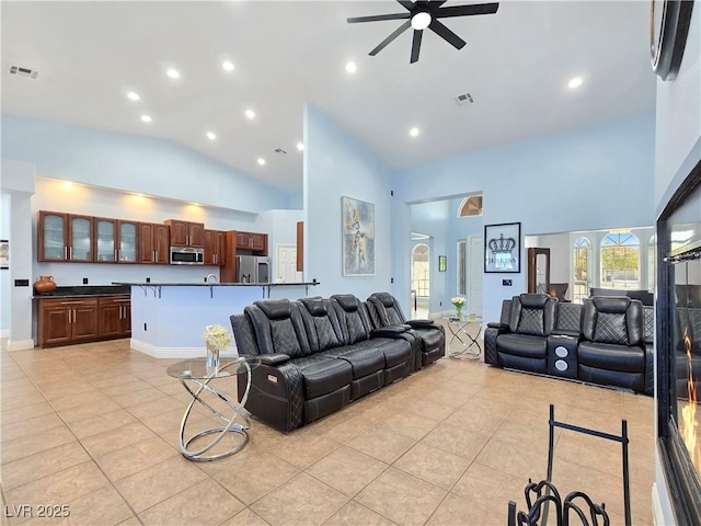 3780 Shawnee Ave, Pahrump, NV 89048 - living area with light tile patterned floors, a ceiling fan, high vaulted ceiling, and recessed lighting