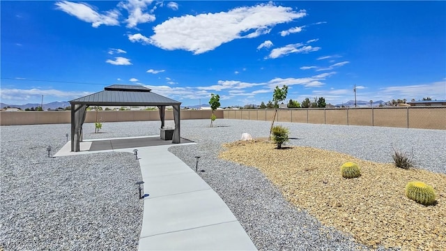 3780 Shawnee Ave, Pahrump, NV 89048 - surrounding community with a gazebo, a fenced backyard, and a patio area