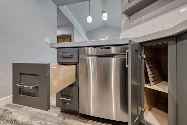 kitchen featuring wood finished floors, dishwasher, vaulted ceiling, and hanging light fixtures