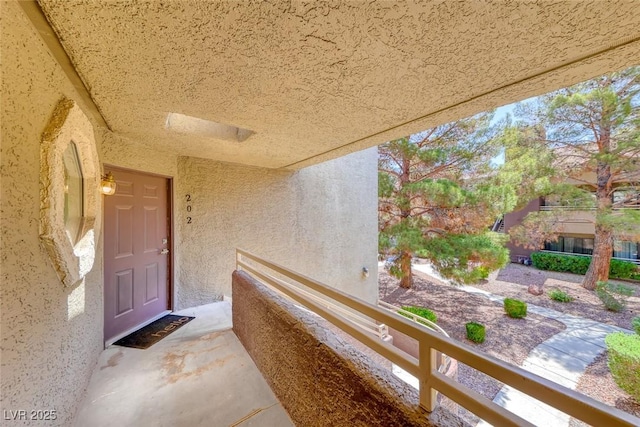 property entrance featuring stucco siding