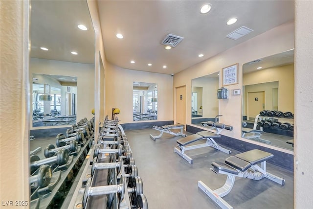 gym featuring recessed lighting