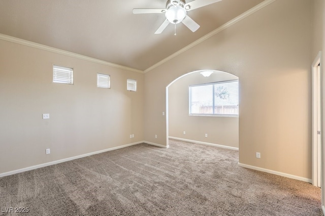carpeted spare room featuring a ceiling fan, crown molding, arched walkways, baseboards, and high vaulted ceiling