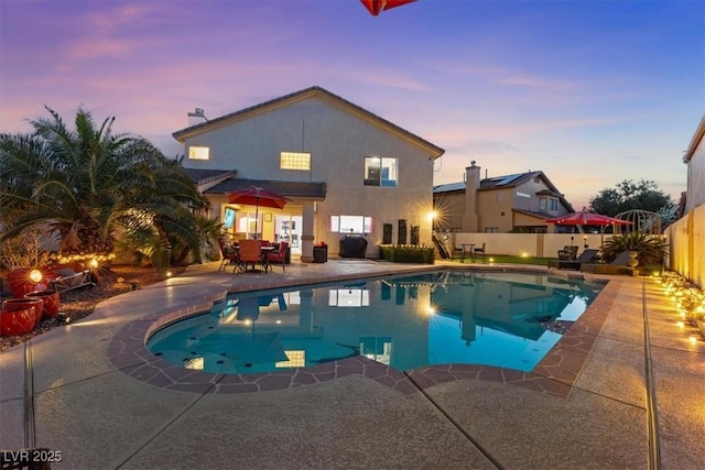 view of pool featuring a patio and a fenced backyard