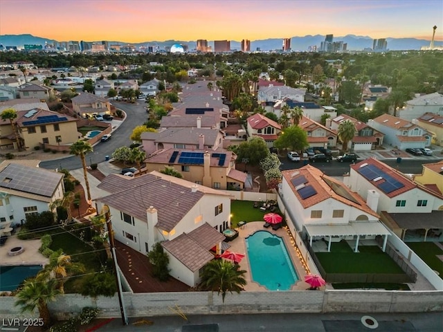 view of urban area with a pool area and nearby suburban area