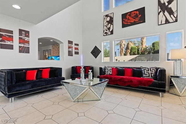 building lobby with a towering ceiling and recessed lighting