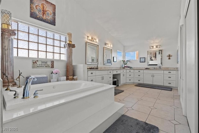 full bath with vanity, a bath, and tile patterned floors