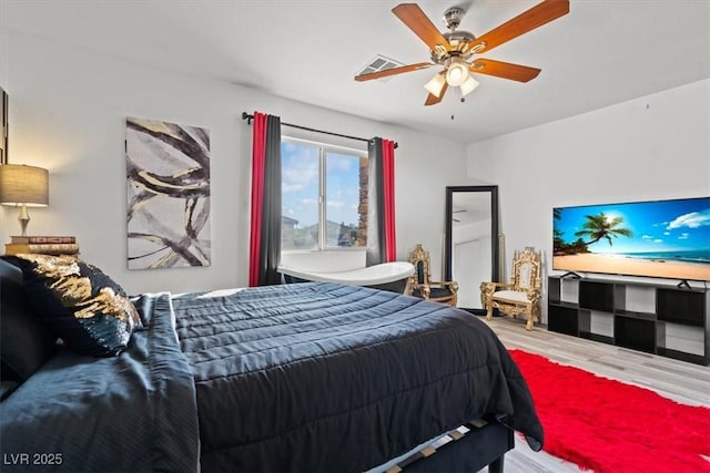 bedroom featuring wood finished floors and ceiling fan