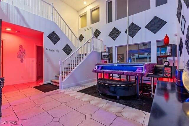 playroom with a high ceiling