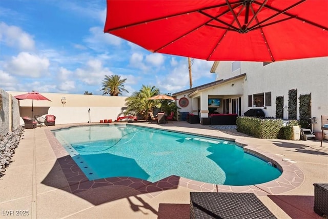 swimming pool with a patio, outdoor lounge area, and a fenced backyard