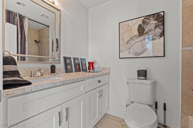 bathroom with a shower, tile patterned flooring, vanity, toilet, and baseboards