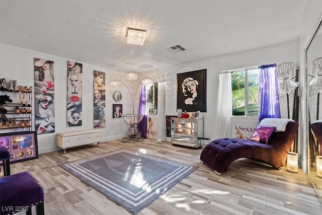 living area featuring wood finished floors and baseboards