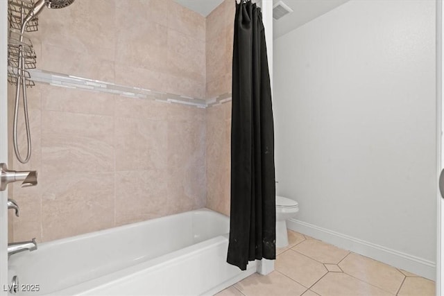 bathroom with tile patterned flooring, shower / tub combo with curtain, toilet, and baseboards