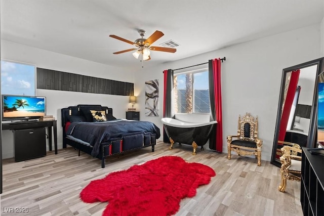 bedroom featuring wood finished floors and a ceiling fan