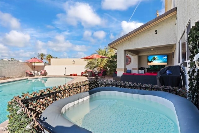 view of pool featuring a fenced backyard and a patio