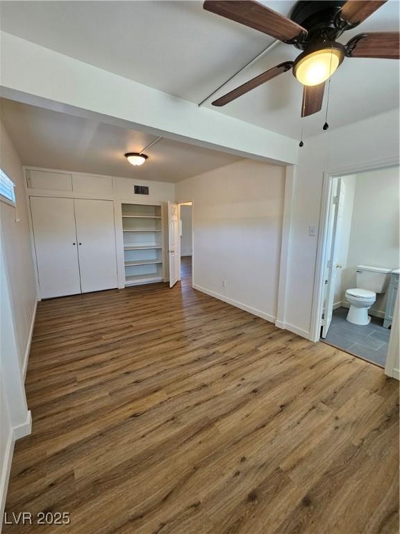 131 Copper St, Henderson, NV 89015 - unfurnished bedroom with wood finished floors, baseboards, and ensuite bath