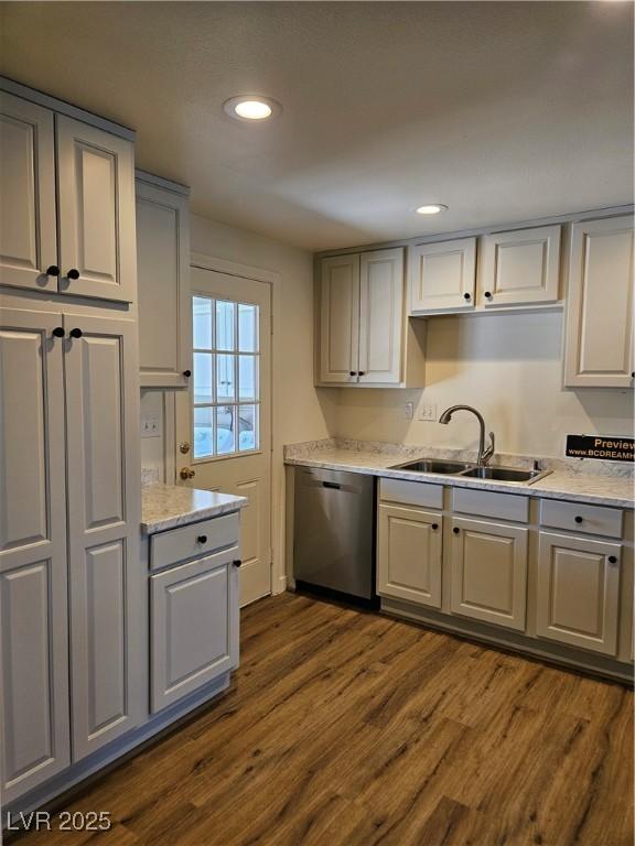 131 Copper St, Henderson, NV 89015 - kitchen with stainless steel dishwasher, dark wood-style flooring, a sink, recessed lighting, and gray cabinets